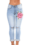 Rose Embroidered Knee Distress Light Wash Skinny Jeans